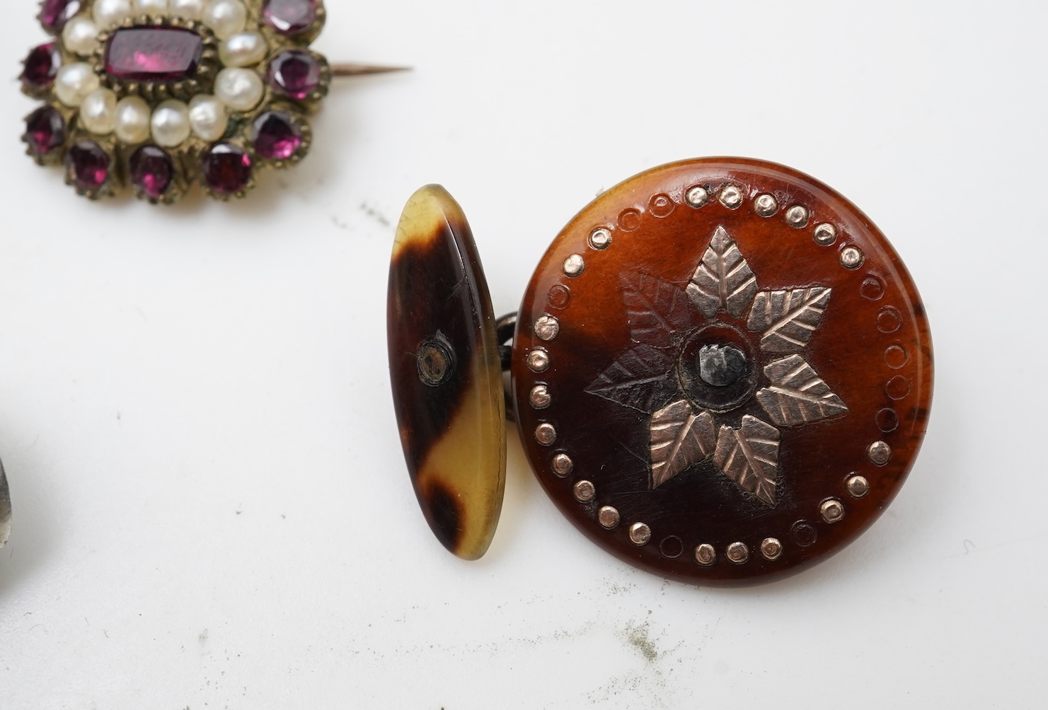 A small group of assorted collectables and jewellery including a Dunhill lighter, 64mm, a George V silver and enamel small compact, silver thimble, two Victorian garnet set brooches, an Edwardian 9ct, amethyst and seed p
